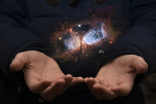 The vast universe in the hands of a child. Elements of this imag — Stock Photo, Image