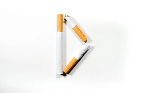 Sigarette piegate a forma di lettera "D" su fondo bianco — Foto Stock