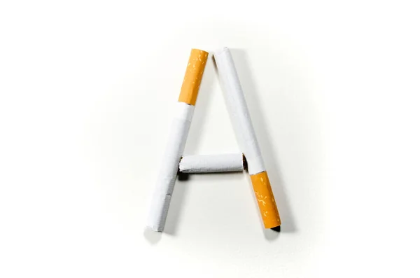 Sigarette piegate a forma di lettera "A" su fondo bianco — Foto Stock