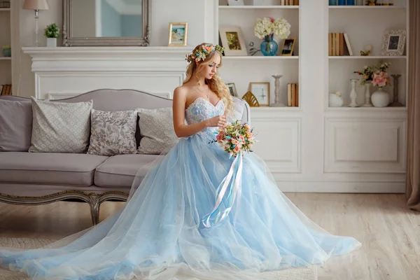 Portrait of a blue-eyed very beautiful blonde girl with a wreath — Stock Photo, Image