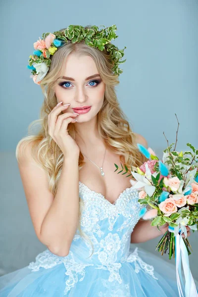 Portrait of a blue-eyed very beautiful blond girl with a wreath — Stock Photo, Image