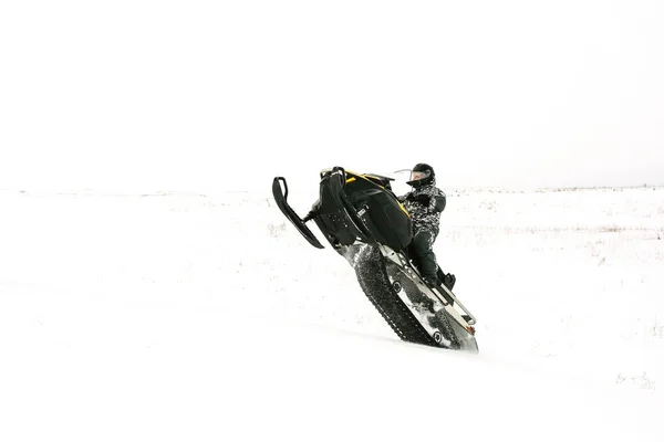 Man on snowmobile. Recreation concept on nature in winter holidays. Winter sports. — Stock Photo, Image