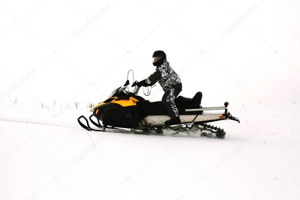Man on snowmobile. Recreation concept on nature in winter holidays. Winter sports.