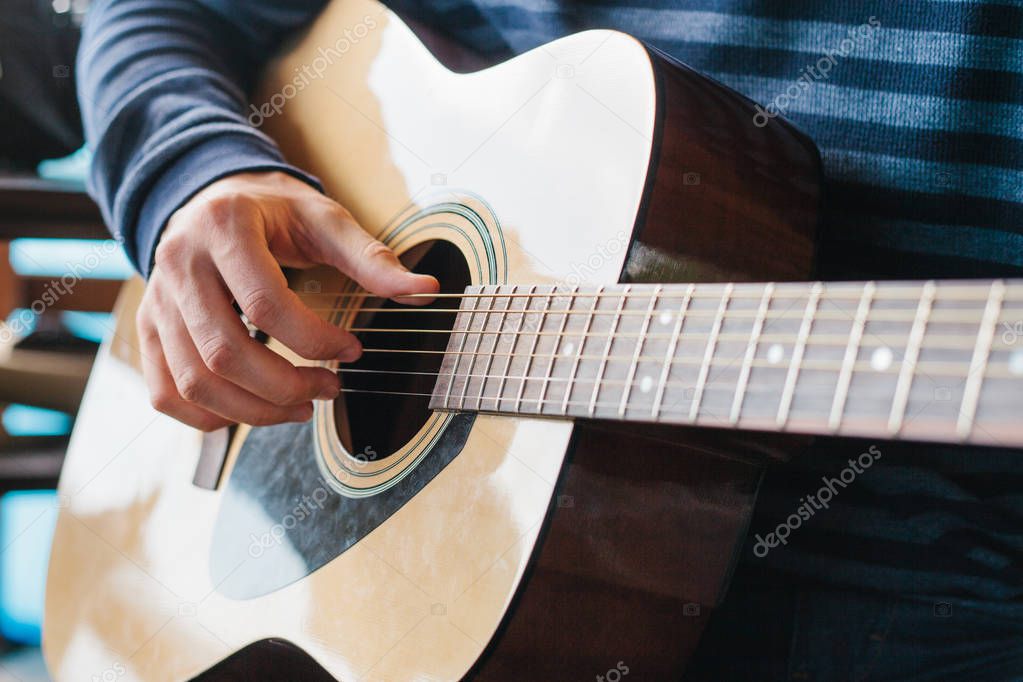 Learning to play the guitar. Music education and extra-curricular lessons.