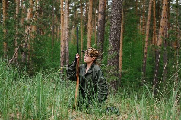 Woman hunter in the woods