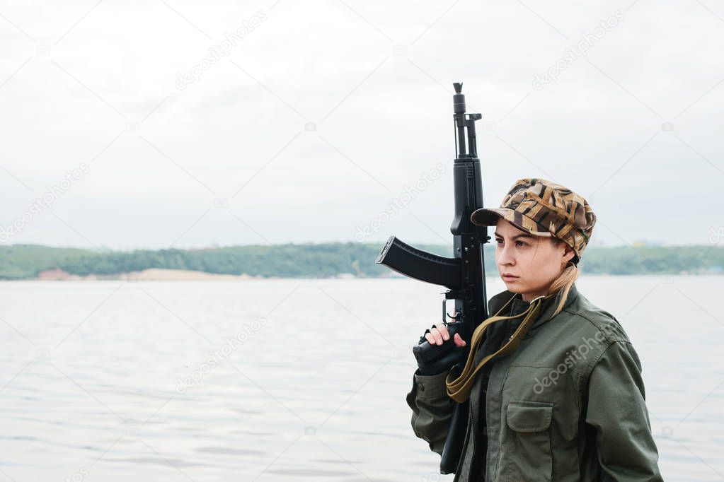 A woman soldier with a weapon