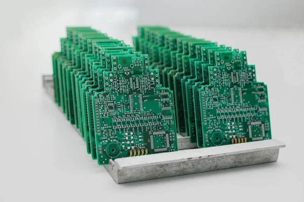 Boards are in a row. Factory for the production of chips. computer board — Stock Photo, Image