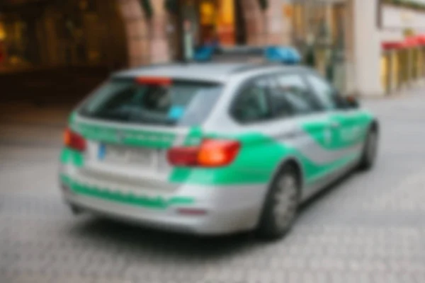 Police car on a city street. Blurred background. Blur. — Stock Photo, Image