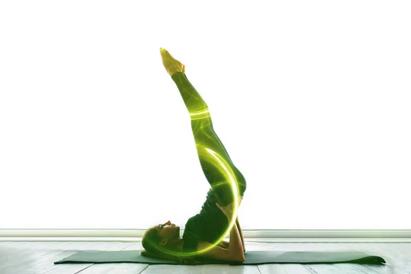 Beautiful woman doing sports (yoga and gymnastics). The concept of practicing sports in the future with visual effects. Conceptual image of the virtual future of single sports. — Stock Photo, Image