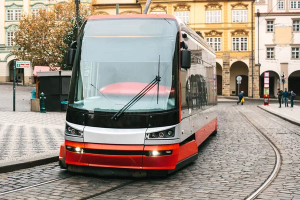 The tram moves around the city in Europe. Urban style of life. Everyday life in Europe.