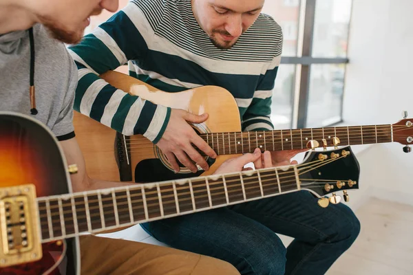 Learning to play the guitar. Music education and extracurricular lessons. — Stock Photo, Image