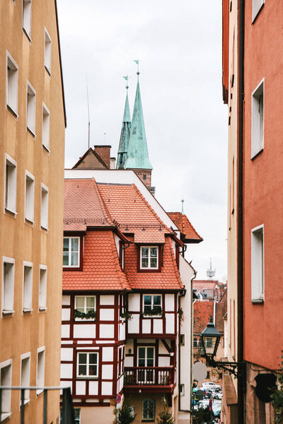 Architecture of buildings and houses in the Germanic style in Nuremberg. A view of a traditional street with such houses. Germsny.
