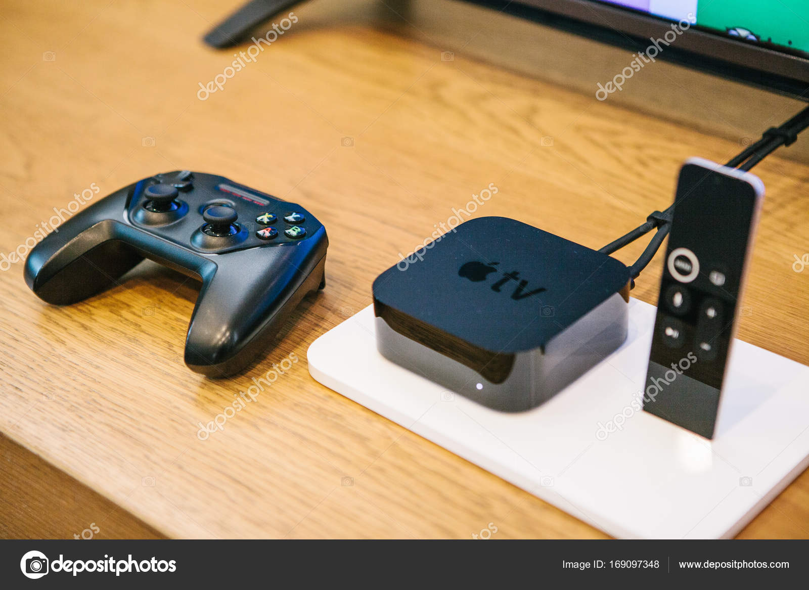 Berlin, 2, presentation of new products in the official Apple store. Modern advanced block Apple TV with a joystick and control panel lie on the table. – Stock Editorial