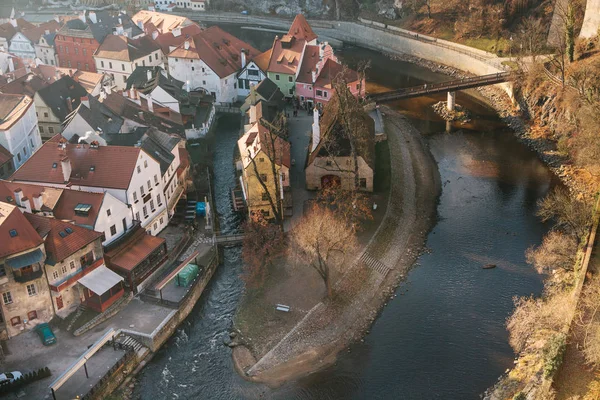 A view from the air to beautiful authentic houses and streets with a river and a bridge in the town of Cesky Krumlov in the Czech Republic. One of the most beautiful small towns in the world. Europe.