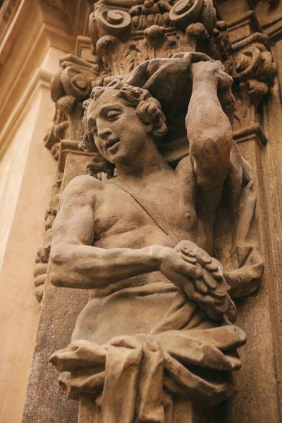 Antique style sculpture on the facade of building