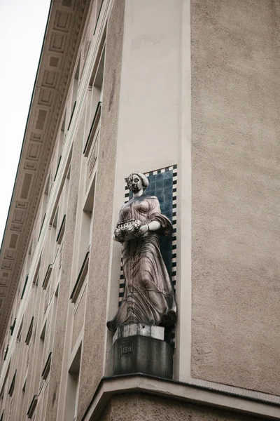 Antique style sculpture on the facade of building