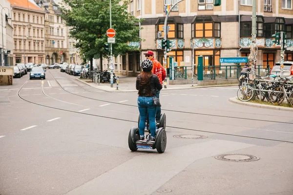 Berlin, October 3, 2017: Tourists riding on gyroscooters along the streets of Berlin during excursion — Stock Photo, Image