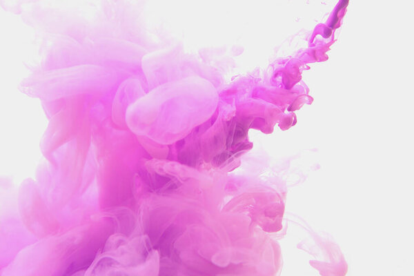 Abstract flowing liquid or violet ink in water on a white background. It looks like smoke or cloud. Or zero gravity.