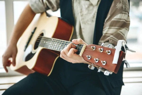 The guitarist plays the guitar