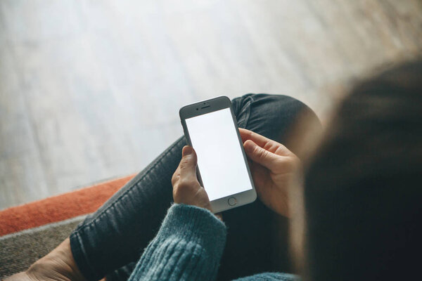 Girl uses a cell phone mockup.