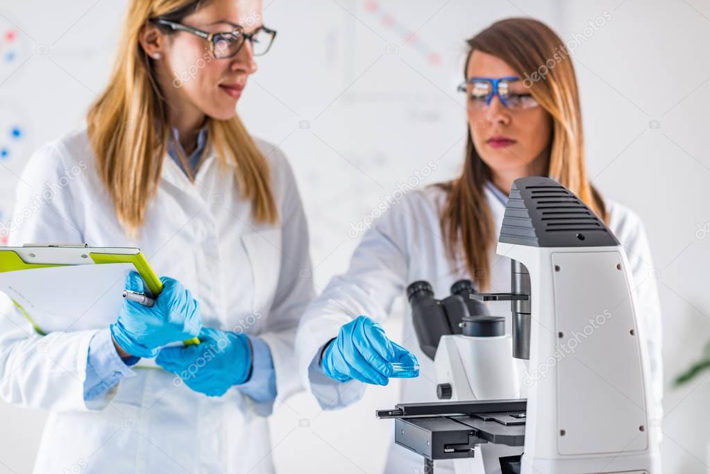  Biotechnology. Female scientists working in laboratory