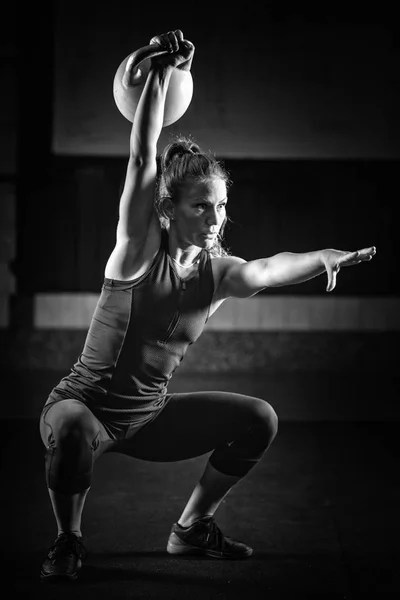 Woman Athlete Exercising Kettlebell Indoors — Stock Photo, Image