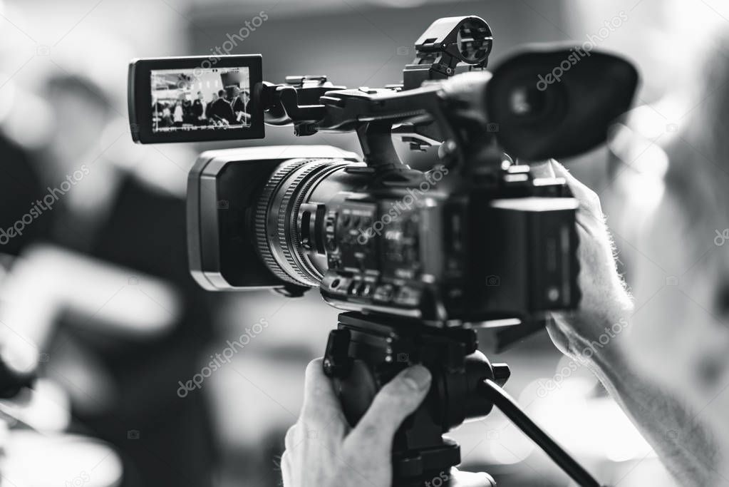 close up of Camera at a press conference