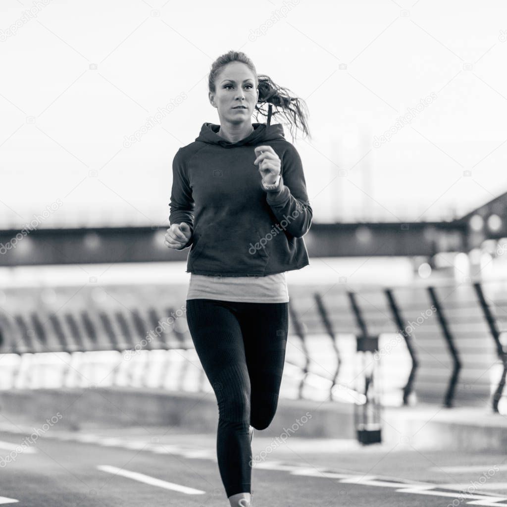 young Woman jogging outdoors 