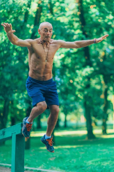 Senior Male Exercising Outdoors Public Park — Stock Photo, Image