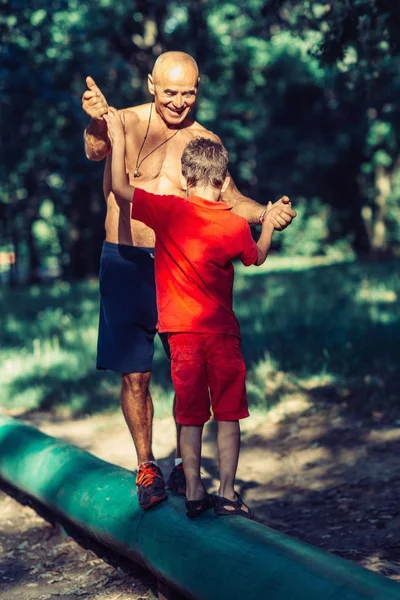 Grandfather Grandson Walking Wooden Huddle Park — Stock Photo, Image