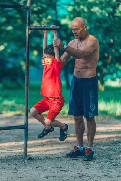 Grandfather Grandson Exercising Park — Stock Photo, Image