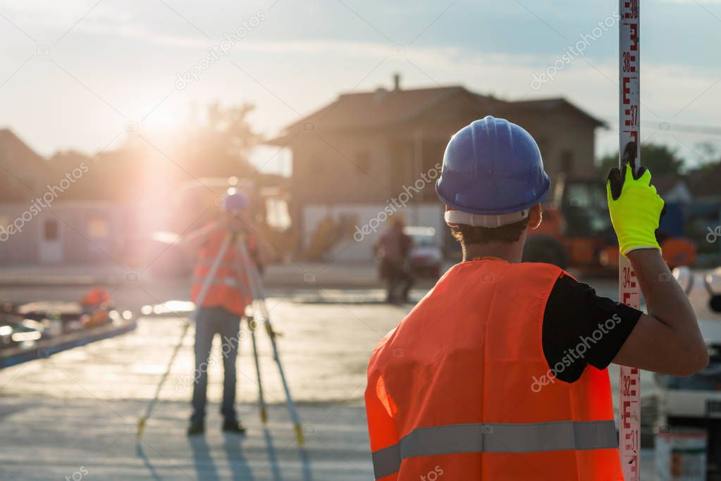 Surveyors working on construction site
