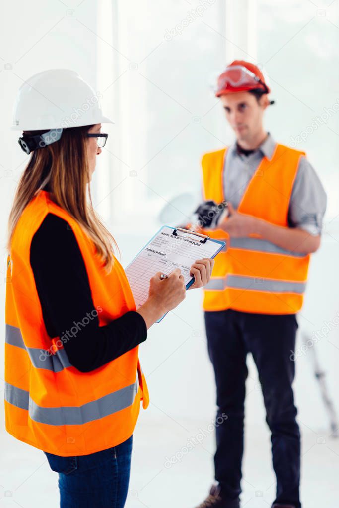 Maintenance Engineers on construction site checking light