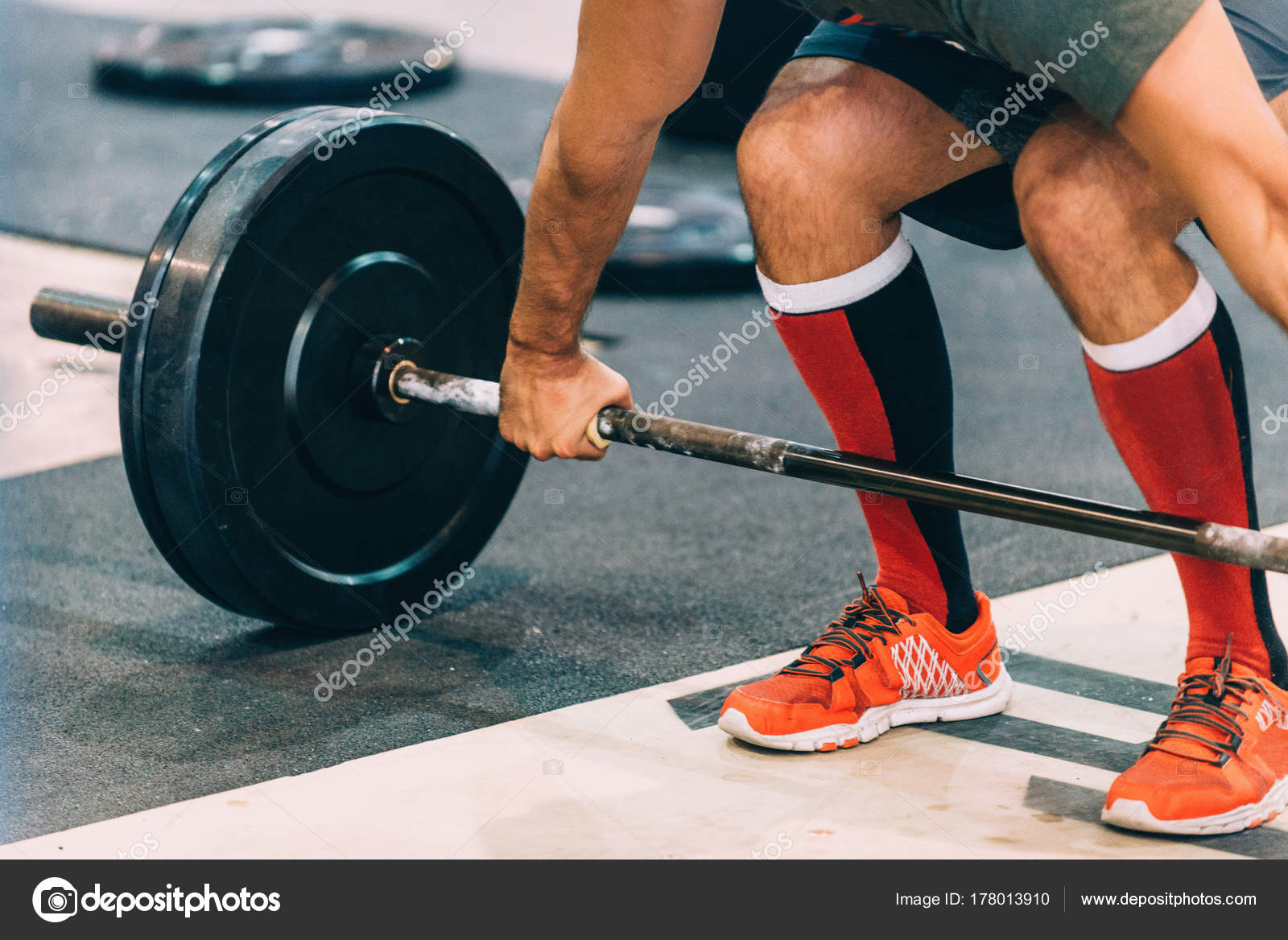 Male Athlete Doing Weightlifting Exercise Stock Photo by ©microgen