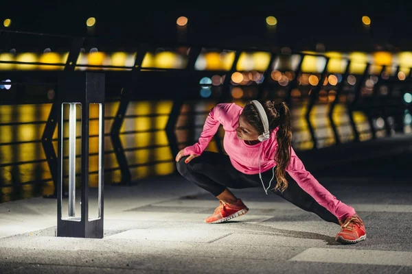 woman at Late night Stretching after jogging