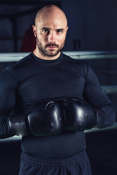 Man on boxing training in the ring 