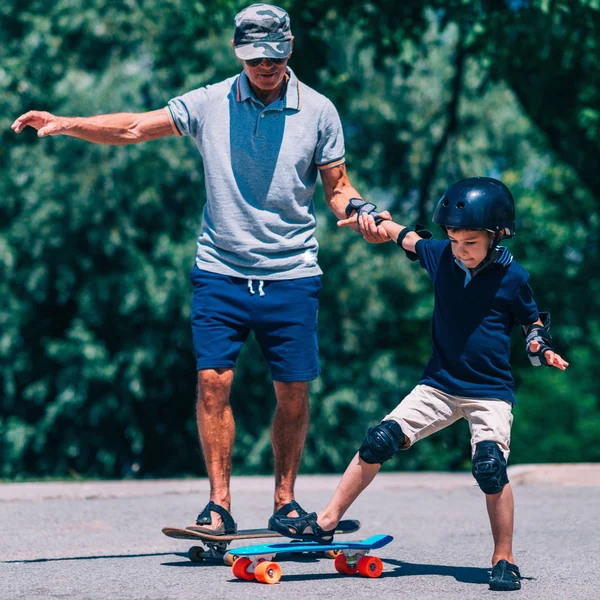 Grandfather Grandson Skateboarding Together — Stock Photo, Image