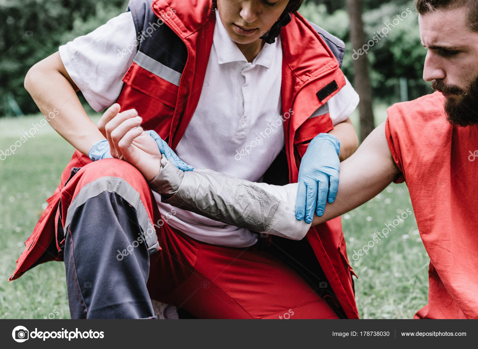 Woman Doing First Aid Paramedic Training Treating Third Degree Burns