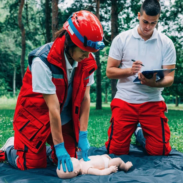 Cpr Practice Woman Man Cpr Baby Dummy Outdoors — Stock Photo, Image