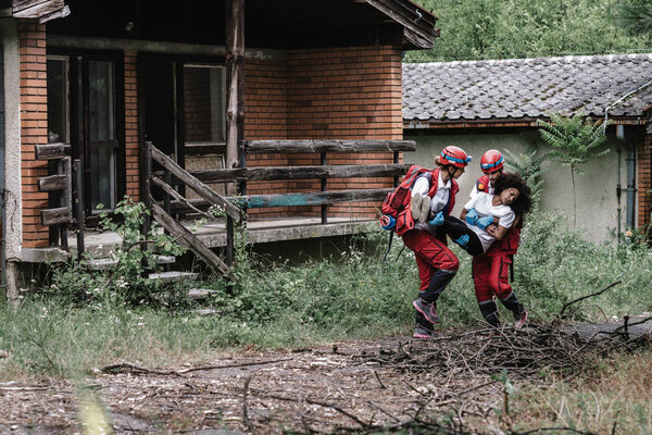 Rescue team saving a natural disaster victim