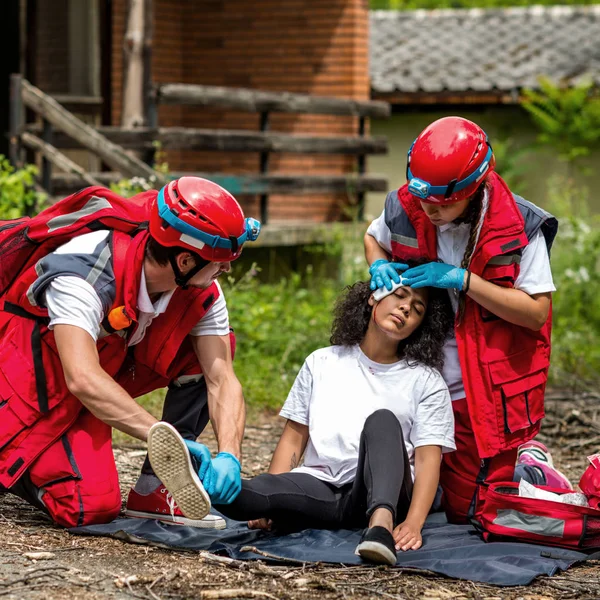 Rescue team helping injured victim