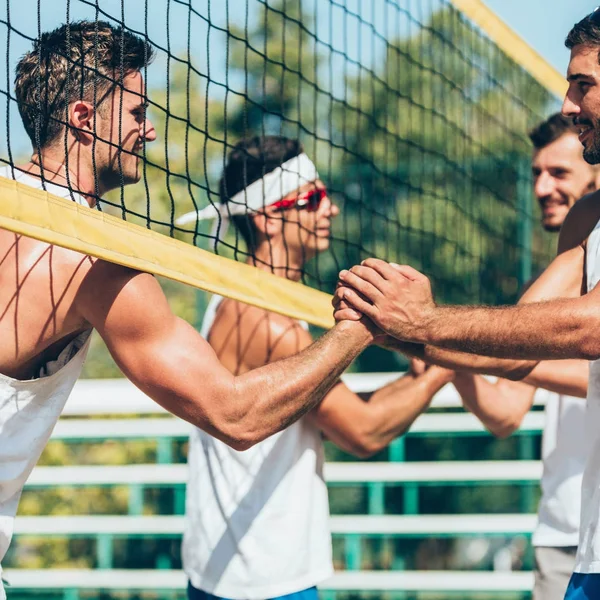 Beach volleyball players Greeting each other for good match