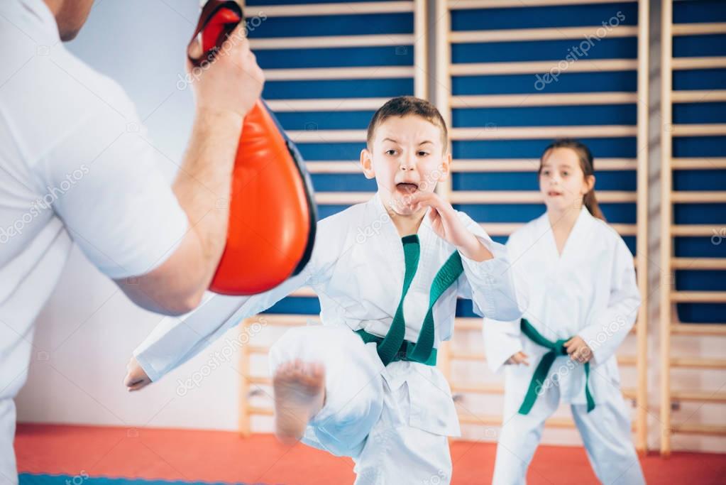 Group of children on Tae kwon do training with trainer