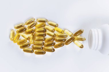 Omega 3 takviyeleri. Softgel destek kapsülleri, balık şekilli.