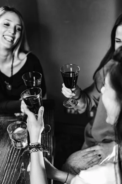 Red Wine Toasting. Female Friends Toasting With Red Wine, Having Fun.