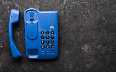 Office keyphone siyah bir beton tablo. Üstten Görünüm.