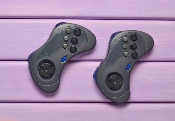Two Wireless Gamepad Purple Wooden Table Top View — Stock Photo, Image