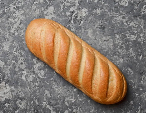 Ένα Καρβέλι Ψωμί Έναν Συγκεκριμένο Πίνακα Top View — Φωτογραφία Αρχείου