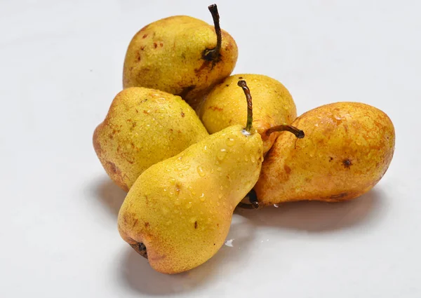 Pears in drops of water on a white background. — Stock Photo, Image