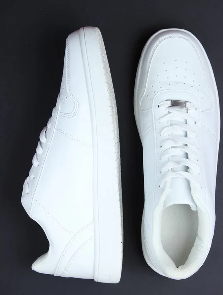 Fashionable White Sneakers Black Background Top View — 图库照片